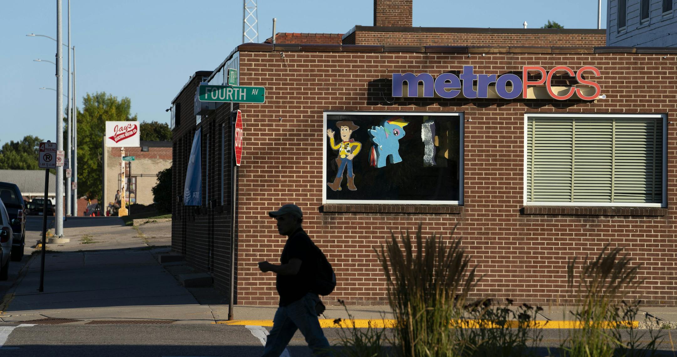 Pinatas hang in the window of Miguel Rivas's Worthington, Minnesota, cellphone shop where he also sells party items made by his son. Now a member of the Chamber of Commerce, Rivas knew no English when he fled El Salvador and arrived in the area 20 years ago. He supports the expansion of local schools because, "If the city is getting bigger, the schools need to grow, too." MUST CREDIT: Photo for The Washington Post by Courtney Perry.