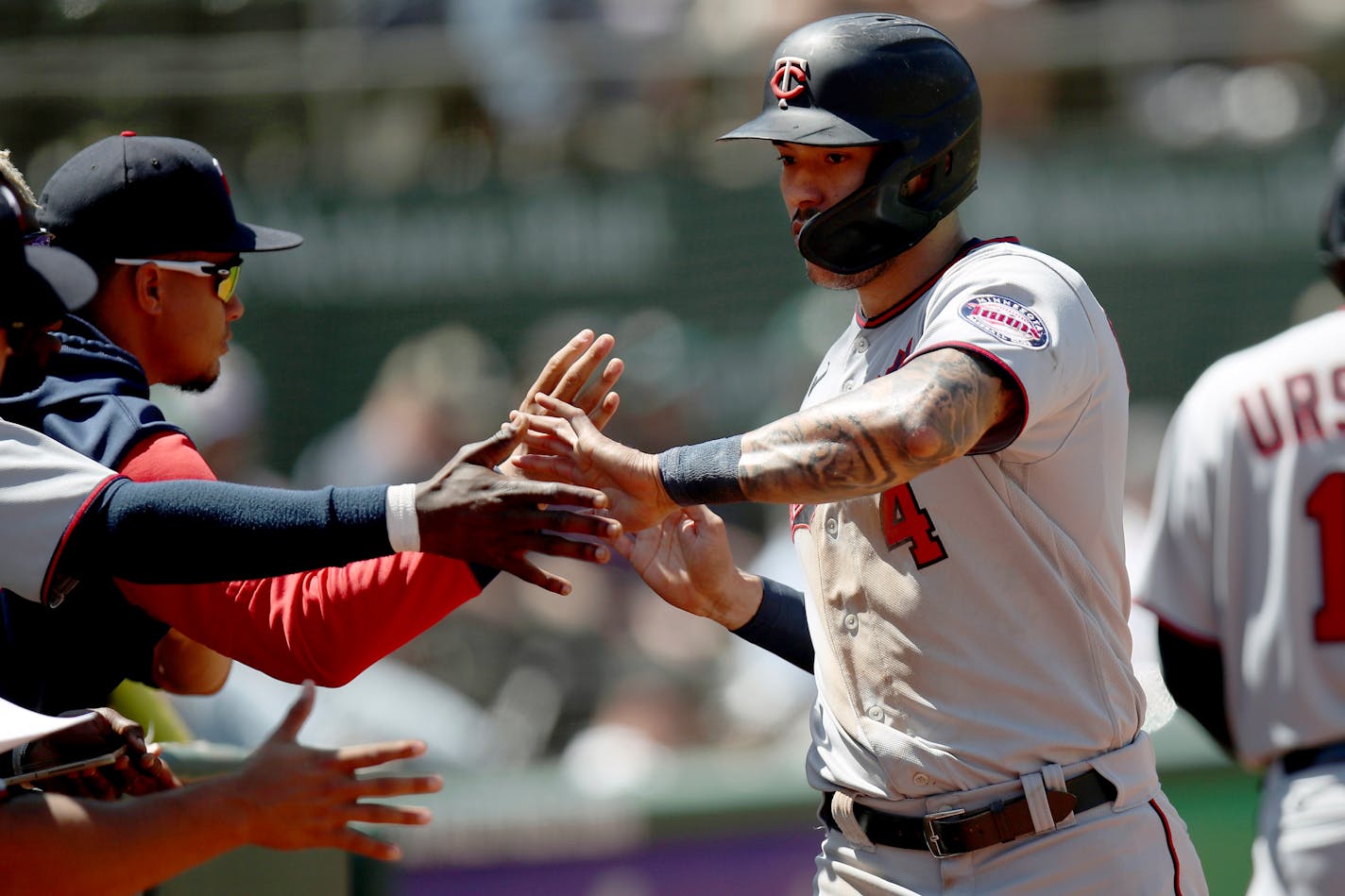 Carlos Correa is congratulated after scoring in the sixth inning of Wednesday's game against the Athletics