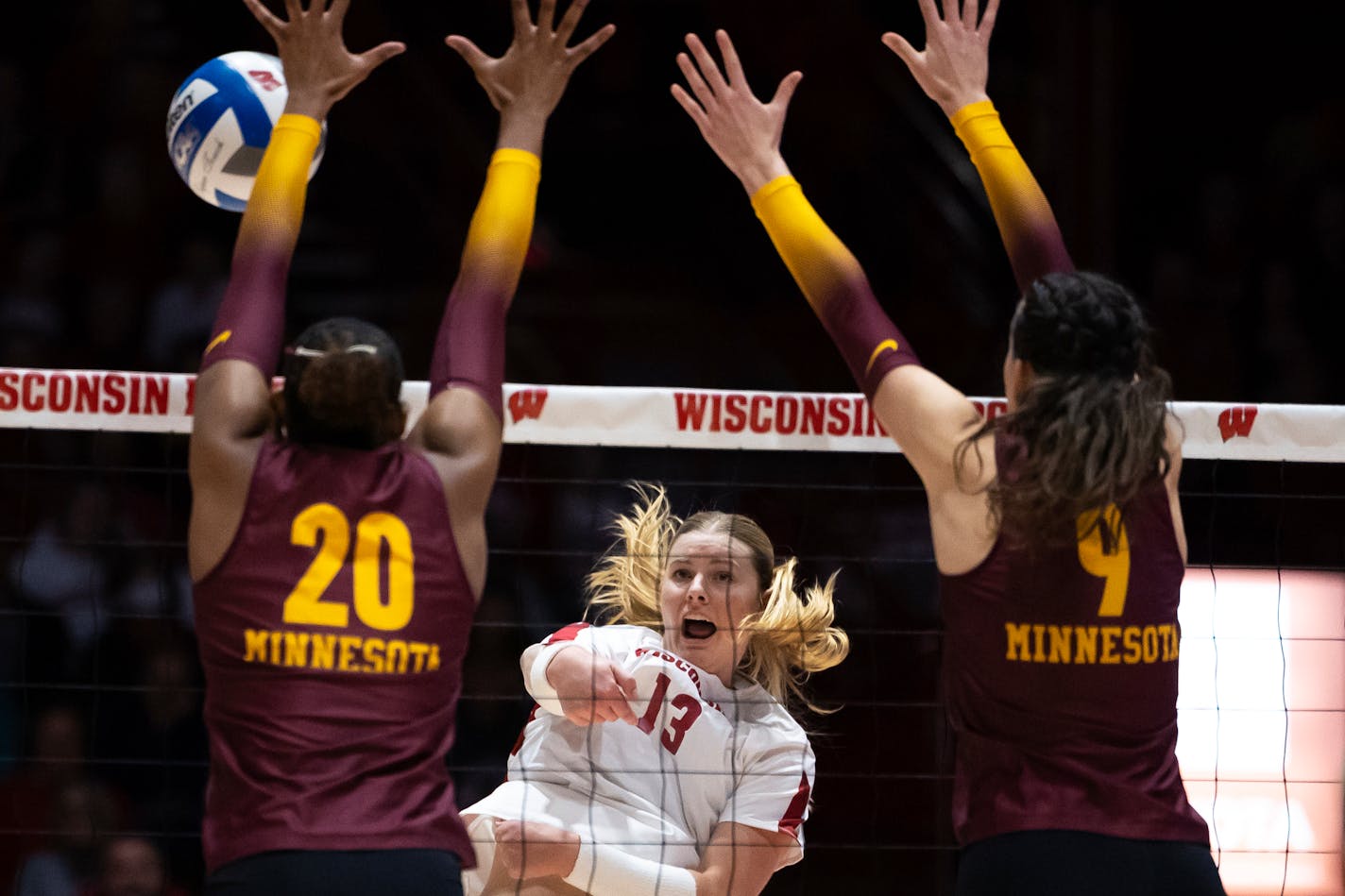 Wisconsin's Sarah Franklin (13) spikes the ball in the first set against Minnesota during an NCAA college volleyball match in Madison, Wis., Sunday, Oct. 29, 2023. (Samantha Madar/Wisconsin State Journal via AP)