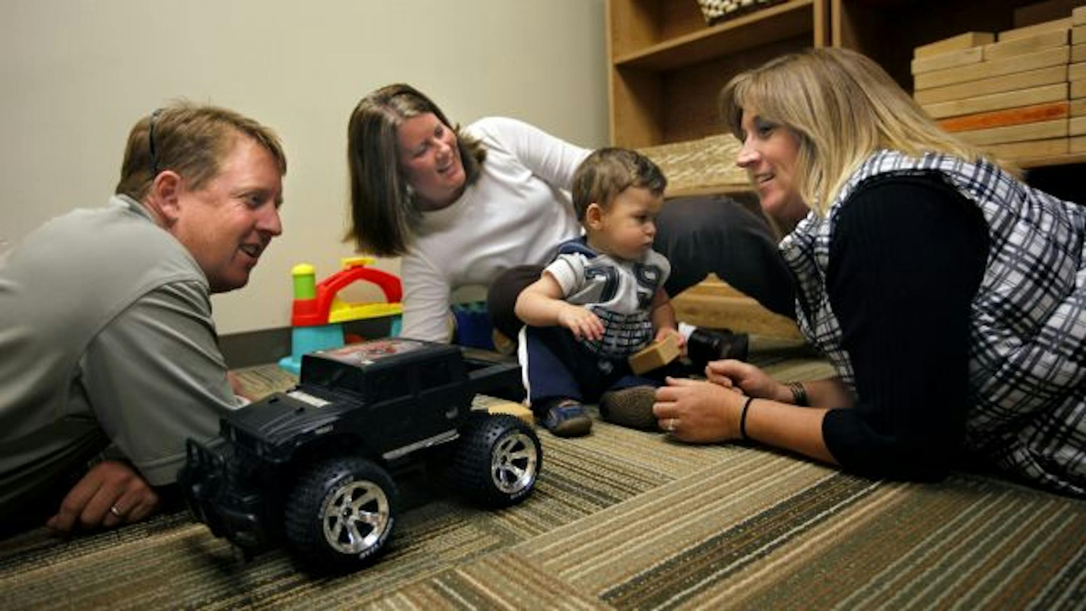 Mark and Jenni Taylor of Farmington and their son, Mason, see Julie Degnan, Mason's birth mother, every couple of months.