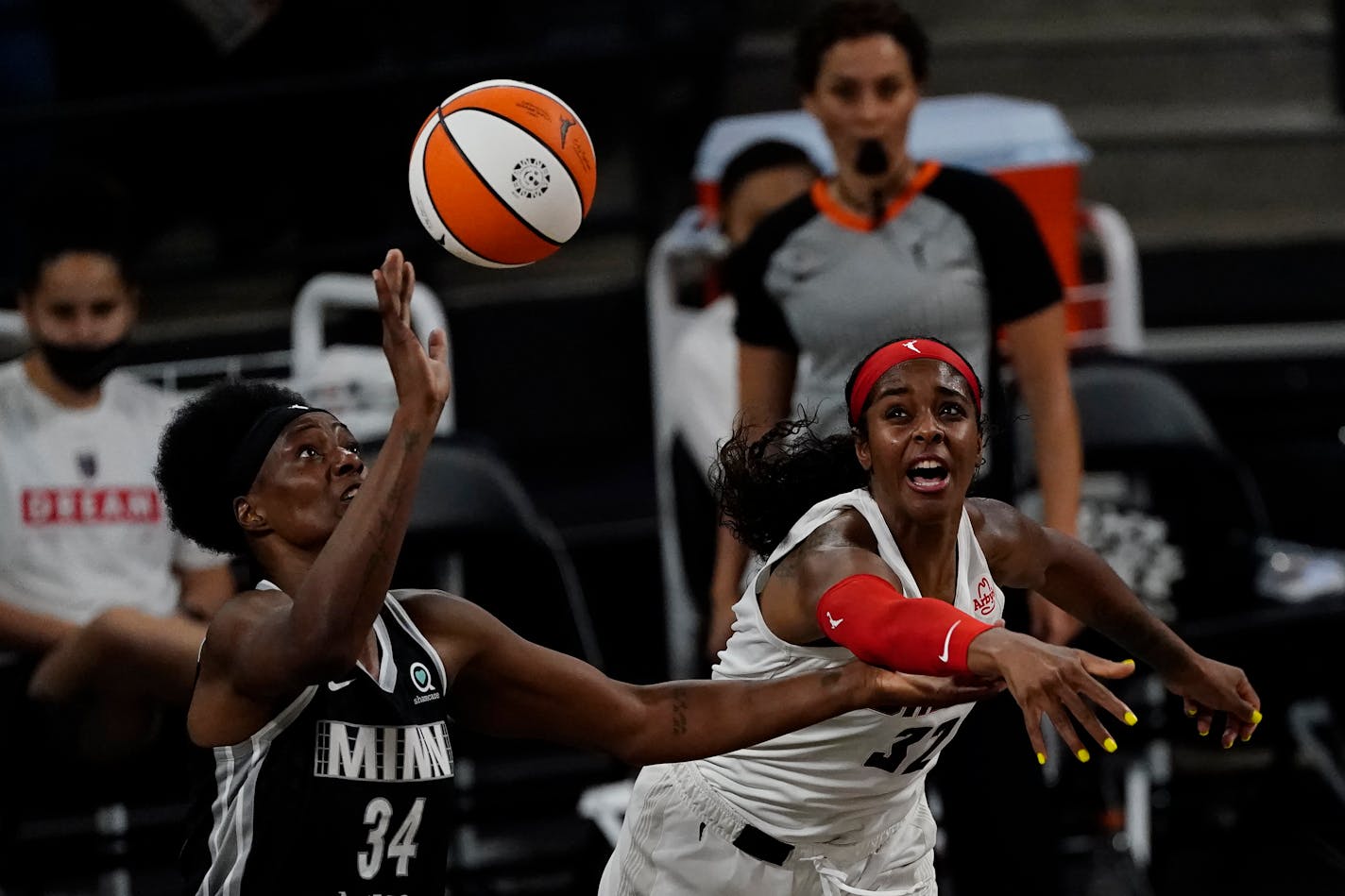 Minnesota Lynx center Sylvia Fowles (34) and Atlanta Dream forward Cheyenne Parker (32) battle for a rebound during the first half of their WNBA playoff game Wednesday, June 23, 2021, in College Park, Ga. (AP Photo/John Bazemore) Minnesota Lynx