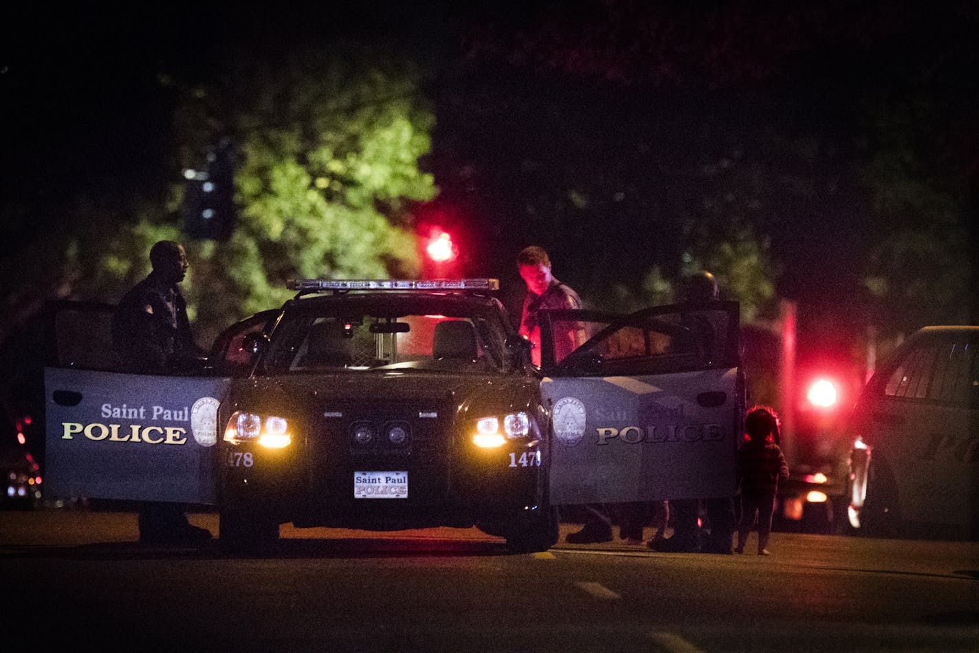 St. Paul police escorted children from a home while investigating an officer-involved shooting Thursday night on the 400 block of Earl Street.