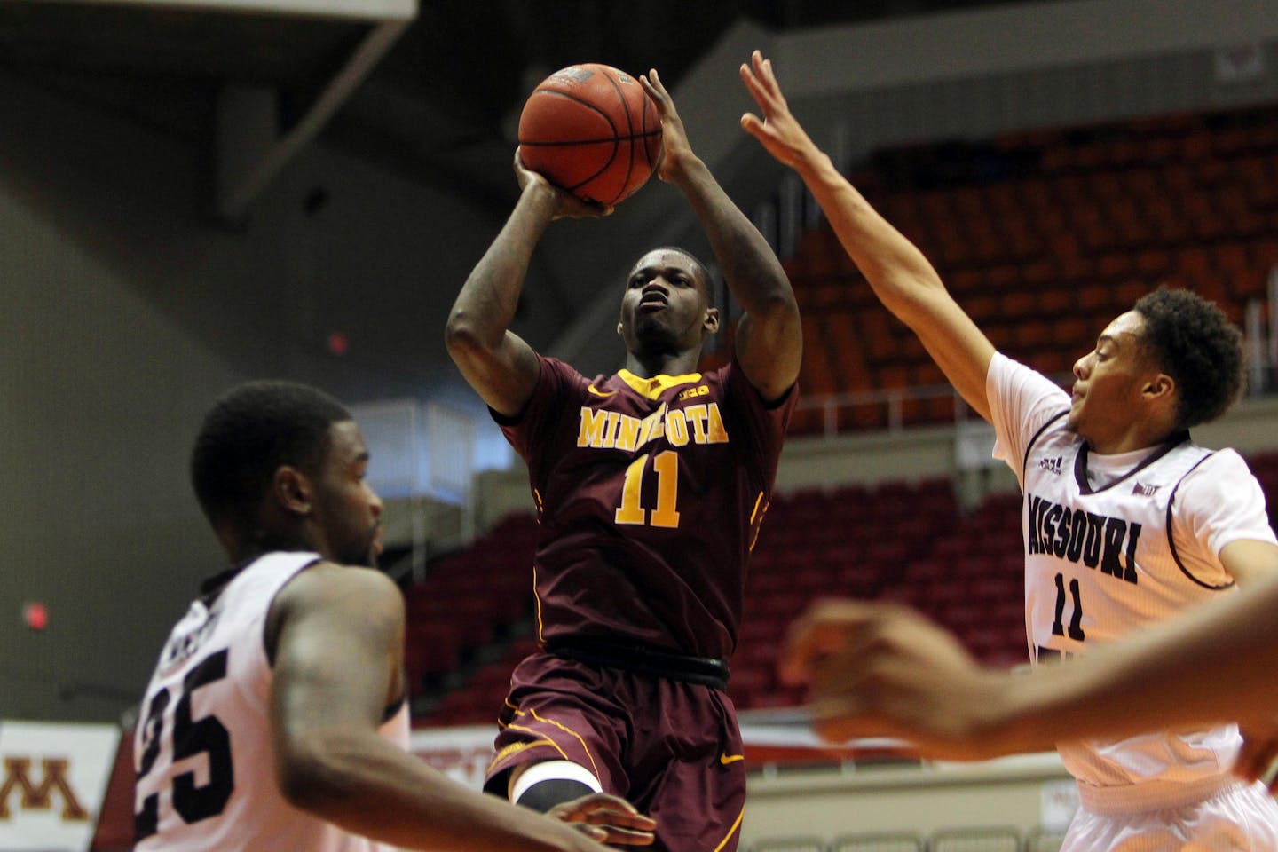 Minnesota guard Carlos Morris, center, goes to the basket against Missouri St. guard Jarred Dixon, right, and teammate Jordan Martin, during the Puerto Rico Tip-Off college basketball tournament in San Juan, Friday, Nov. 20, 2015.