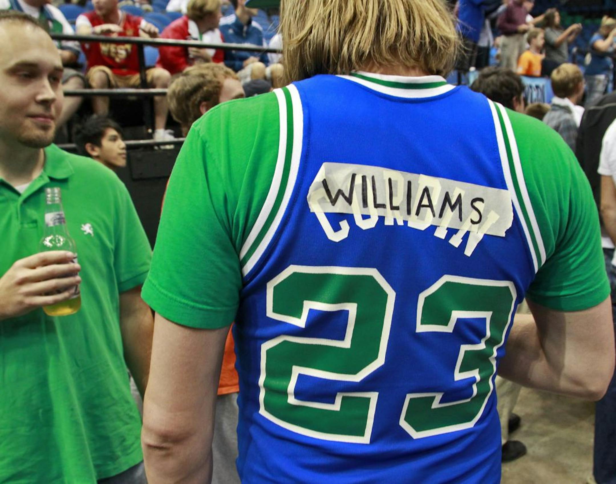 A Wolves fan was quick to change his #23 Tyrone Corbin jersey to Derrick Williams, the Wolves first draft pick.