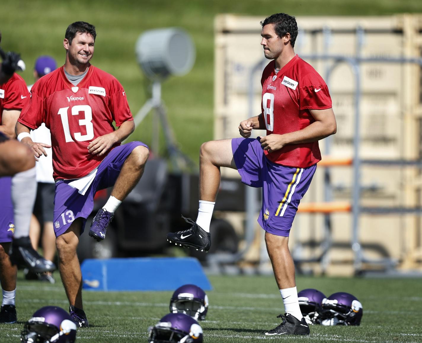 Vikings quarterbacks Shaun Hill, left, and Sam Bradford warmed up during practice Monday at Winter Park.