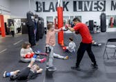 Boxing Coach Jorge Mendoza sparred with his students at Element Gym in St. Paul.