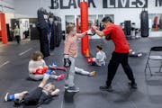Boxing Coach Jorge Mendoza sparred with his students at Element Gym in St. Paul.