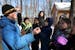 Volunteer Fern Albertson explained how to tap a maple tree to extract sap to a group of students from the Saint John School of Little Canada.
