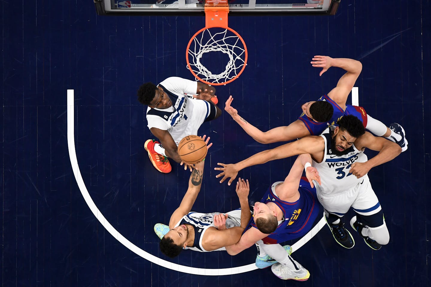 Minnesota Timberwolves guard Anthony Edwards (1), Minnesota Timberwolves center Karl-Anthony Towns (32) and forward Kyle Anderson (5) battle for a rebound with Denver Nuggets forward Michael Porter Jr. (1) and center Nikola Jokic (15) in the first half Thursday, April 21, 2022, at Target Center in Minneapolis, Minn.. The Minnesota Timberwolves were defeated 120-111 by Denver, falling to 0-3 in the series. ] AARON LAVINSKY • aaron.lavinsky@startribune.com