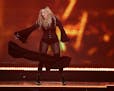 After declaring that it was getting hot in the X, Madonna ripped away part of her dress early in her set at Xcel Energy Center in St. Paul Thursday ni