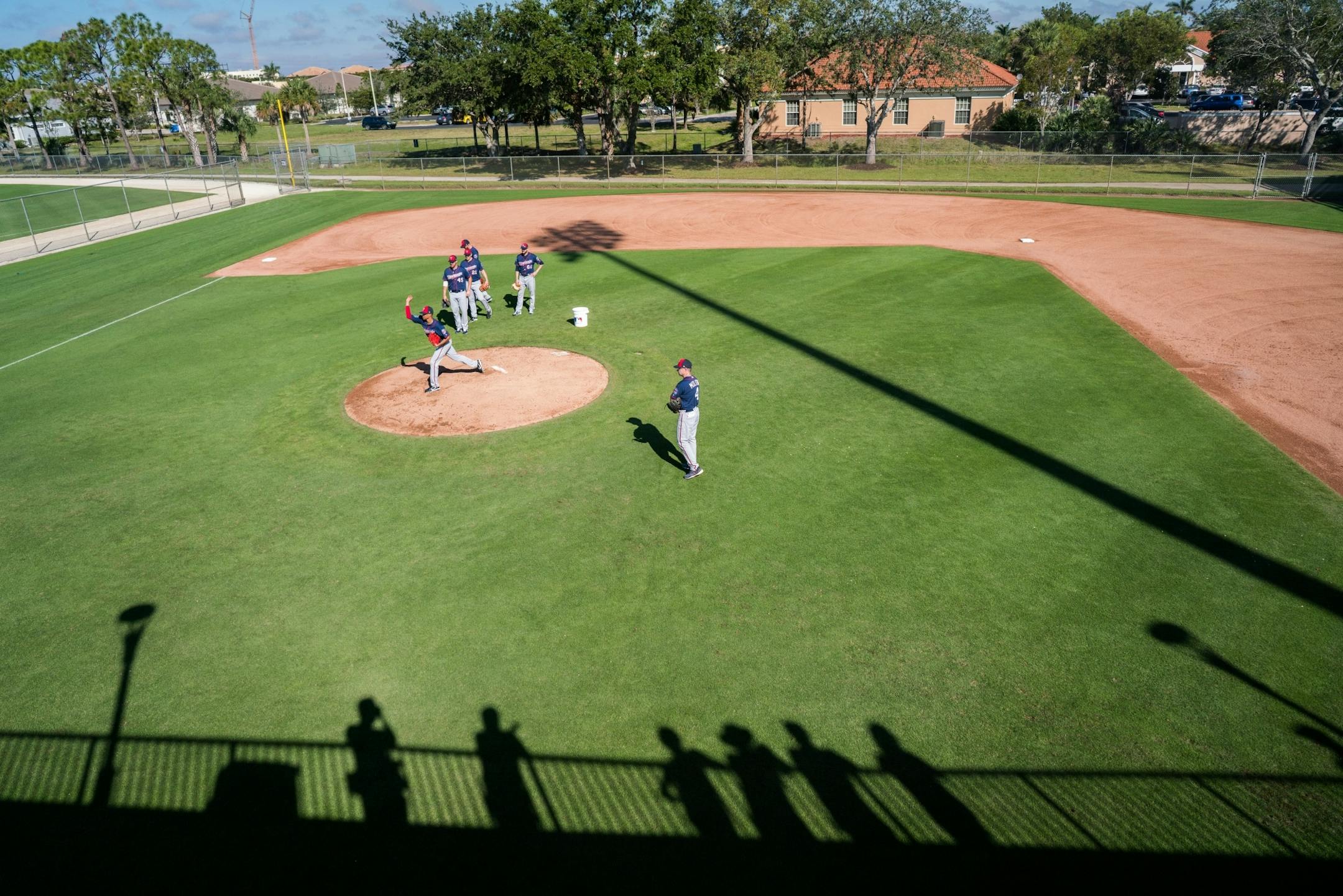 Twins pitchers run drills under the watchful gaze of manager Paul Molitor.