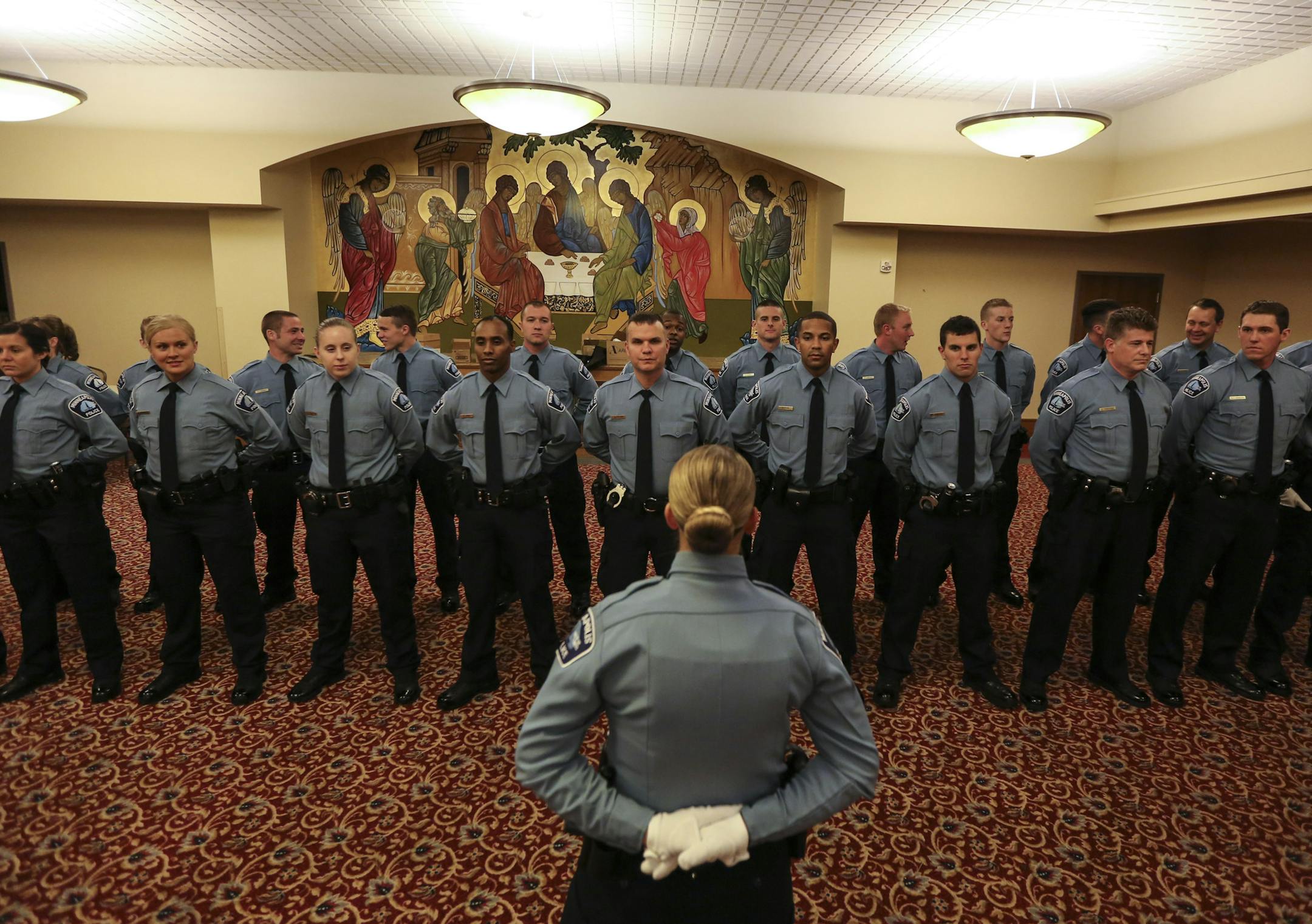 2015 cadets lined up before proceeding out to the Minneapolis Police Department swearing in ceremony in Minneapolis, Minn., on Tuesday, October 20, 2015. ] RENEE JONES SCHNEIDER • reneejones@startribune.com Following a rigorous 30 week training program at the Minneapolis Police Department’s Academy, 26 recruits are now ready to be sworn-in as Minneapolis Police Officers. Eight of the cadets were women.