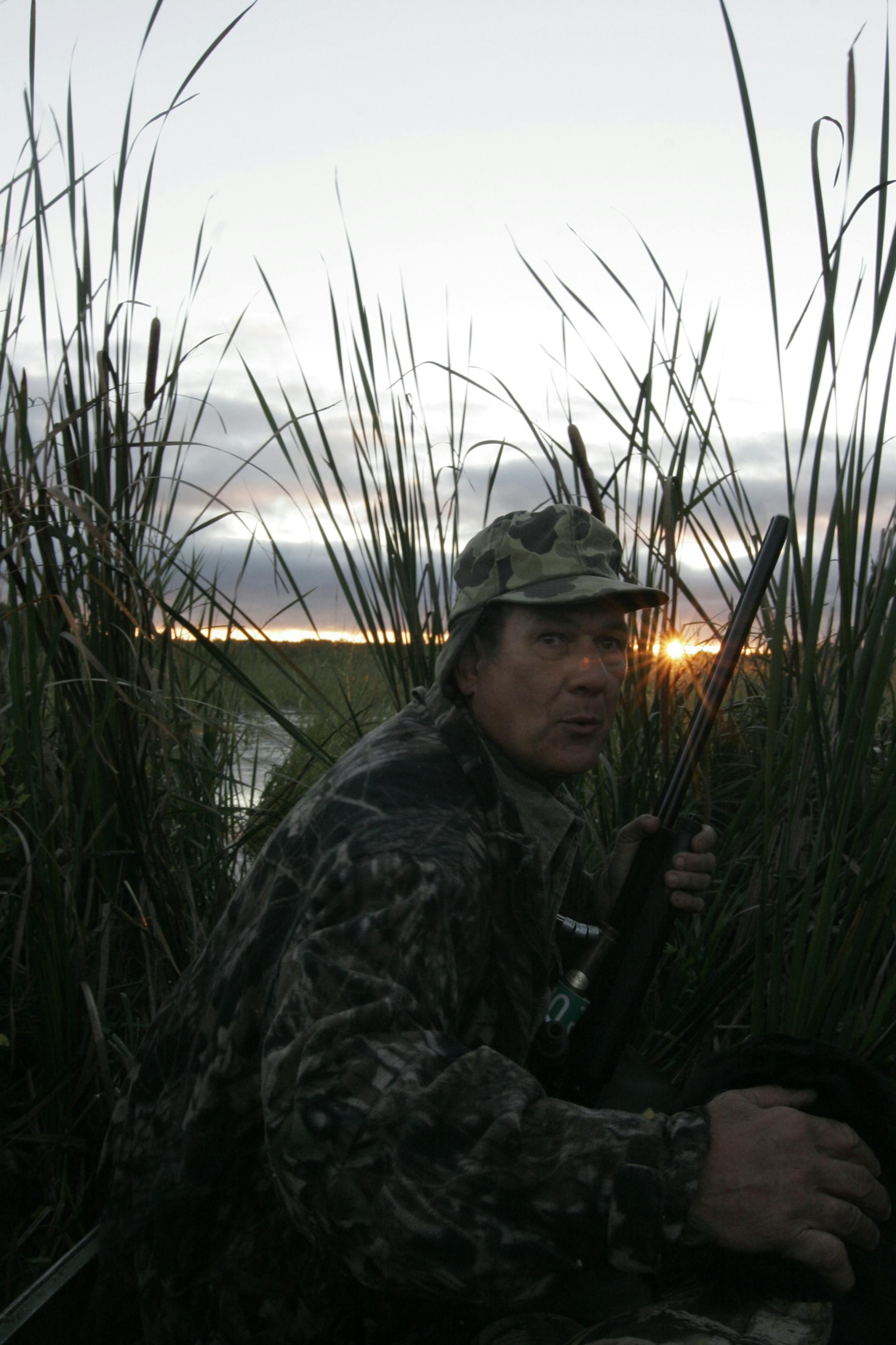 Doug Smith/Star Tribune; Sept. 21, 2013; near Emily, Mn. Rod Ustipak of Baxter, Minn., watches ducks fly over a small wild rice lake in north-central Minnesota on the waterfowl opener. Ustipak heads the state's wild rice program.