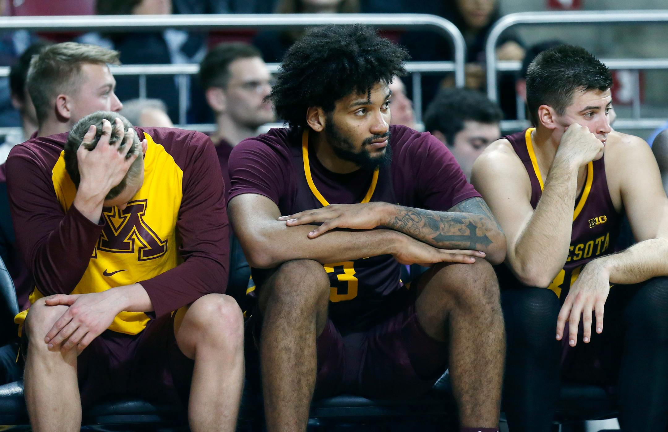 Minnesota's Jordan Murphy (3) and Brock Stull, right, watch from the bench during the second half of an NCAA college basketball game against Boston College in Boston, Monday, Nov. 26, 2018. (AP Photo/Michael Dwyer)