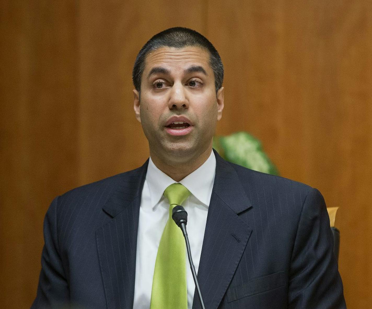 FILE - In this Feb. 26, 2015, file photo, Federal Communication Commission Commissioner Ajit Pai speaks during an open hearing and vote on "Net Neutrality" in Washington. Tech companies are readying for a showdown with a Republican-controlled government over threats to net neutrality, a key issue for them and their users.