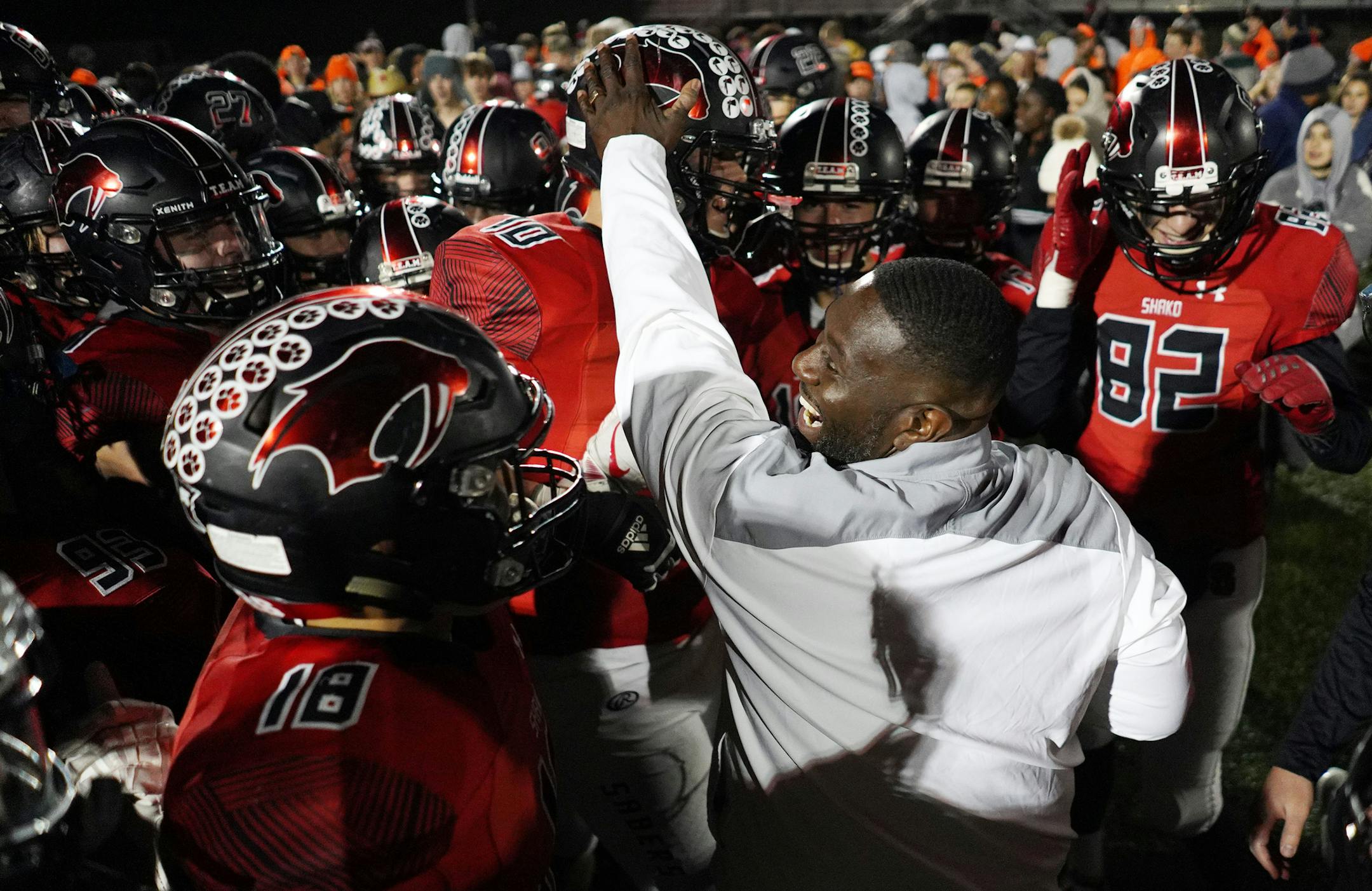 Shakopee head coach Ray Betton celebrated the win with his players Friday night. ] ANTHONY SOUFFLE • anthony.souffle@startribune.com Shakopee played Farmington in a Class 6A football state tournament first round game Friday, Oct. 25, 2019 at Vaughan Field in Shakopee, Minn.