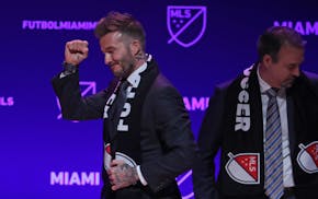 David Beckham, former Major League Soccer player, celebrates the award of a Miami expansion team at an announcement at the Adrienne Arsht Center. on J