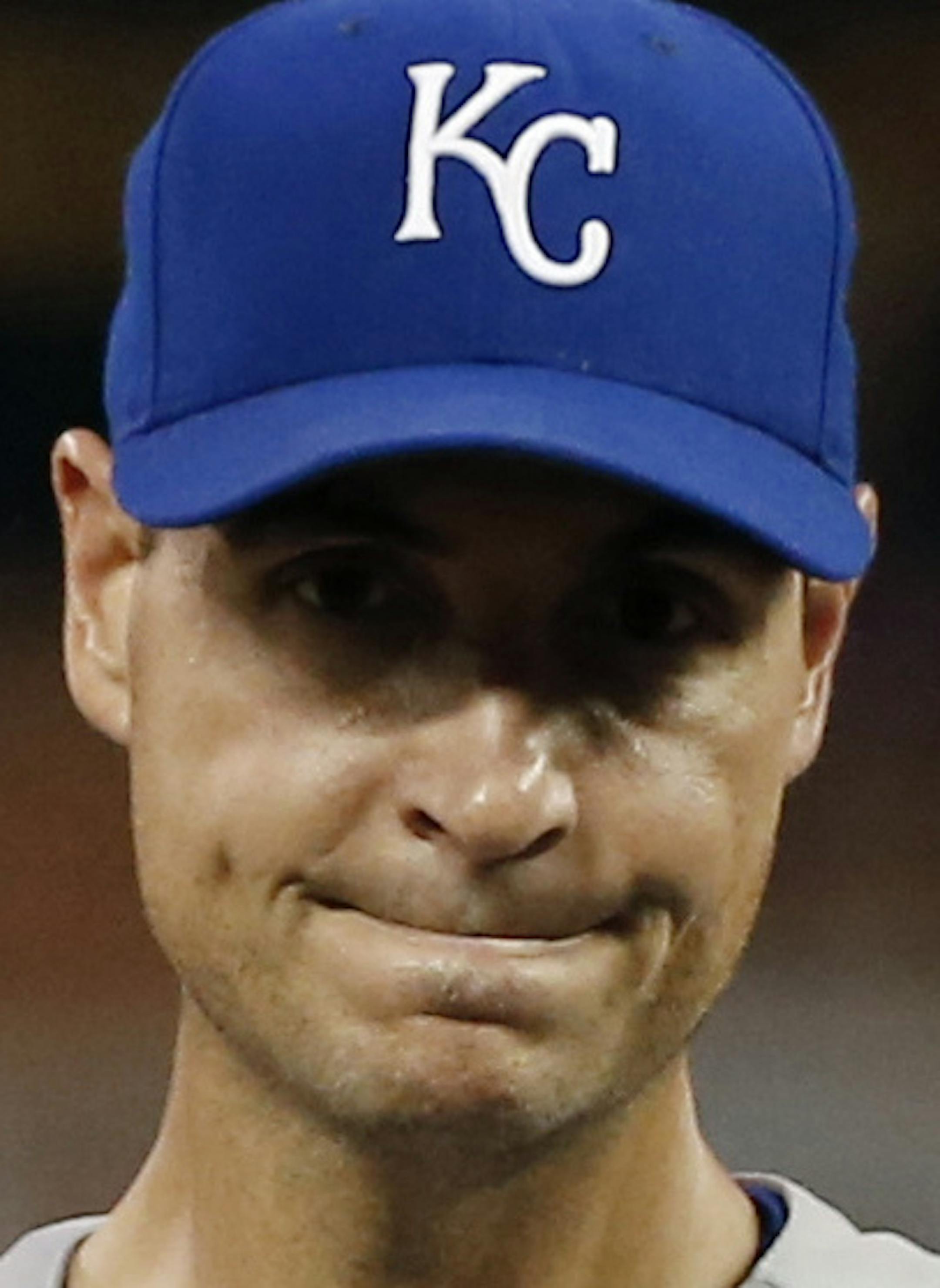 Kansas City Royals pitcher Chris Young, center, waits to be pulled in the seventh inning by manager Ned Yost after Minnesota Twins’ Trevor Plouffe broke up his no-hitter in a baseball game, Tuesday, June 9, 2015, in Minneapolis. The Royals won 2-0. (AP Photo/Jim Mone)