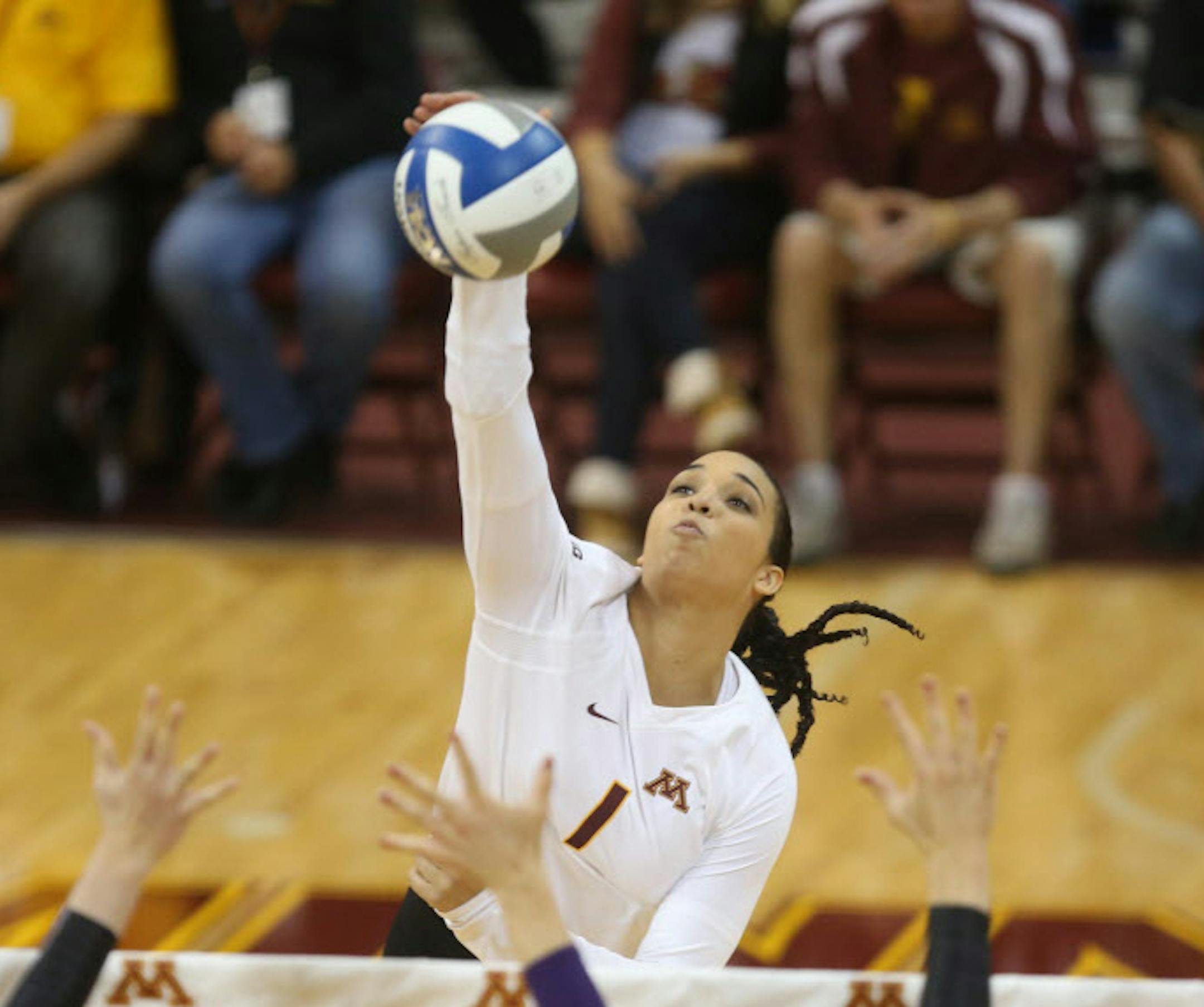 Gophers Daly Santana spiked the ball during the first set earlier in the season.