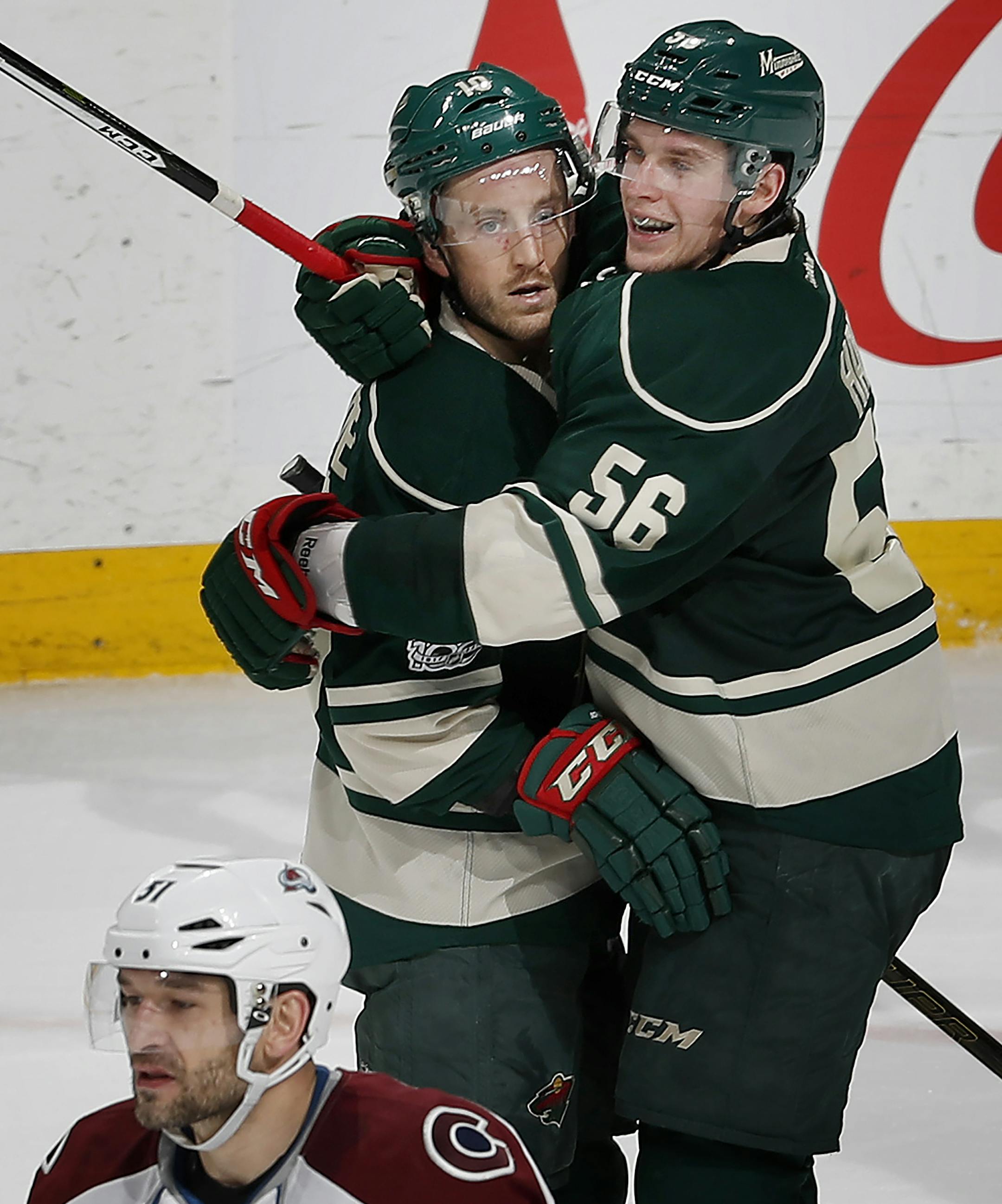 Jordan Schroeder (10) celebrated with Erik Haula (56) after scoring a goal in the second period. ] CARLOS GONZALEZ ï cgonzalez@startribune.com - April 2, 2017, St. Paul, MN, NHL, Hockey, Minnesota Wild vs. Colorado Avalanche