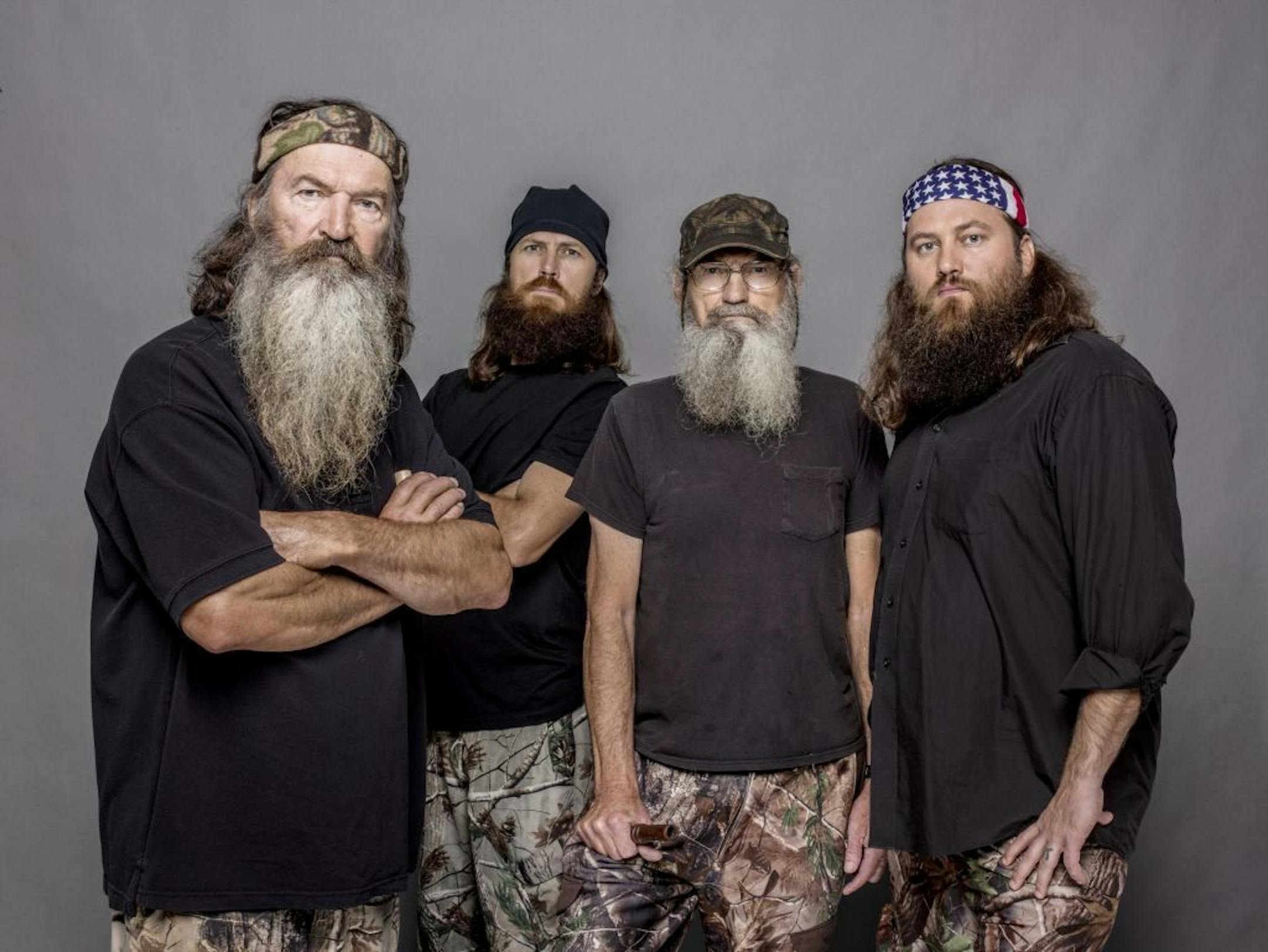 This 2012 photo released by A&E shows, from left, Phil Robertson, Jase Robertson, Si Robertson and Willie Robertson from the A&E series, "Duck Dynasty."