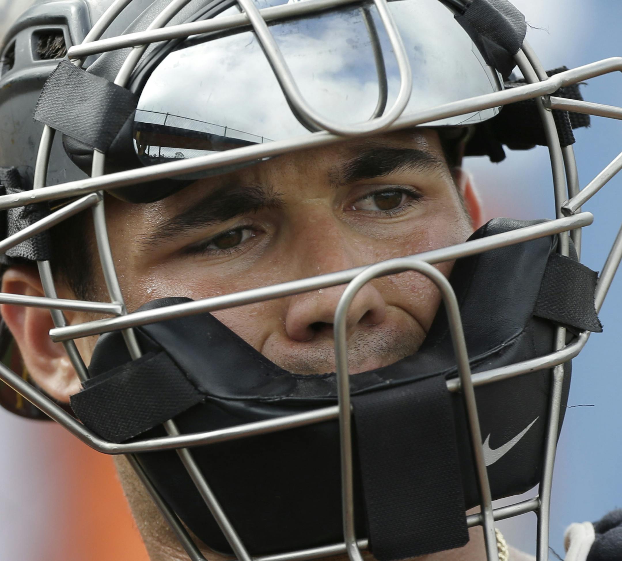 Pittsburgh Pirates catcher Tony Sanchez throws during a baseball spring training workout Wednesday, Feb. 13, 2013, in Bradenton, Fla. (AP Photo/Charlie Neibergall)