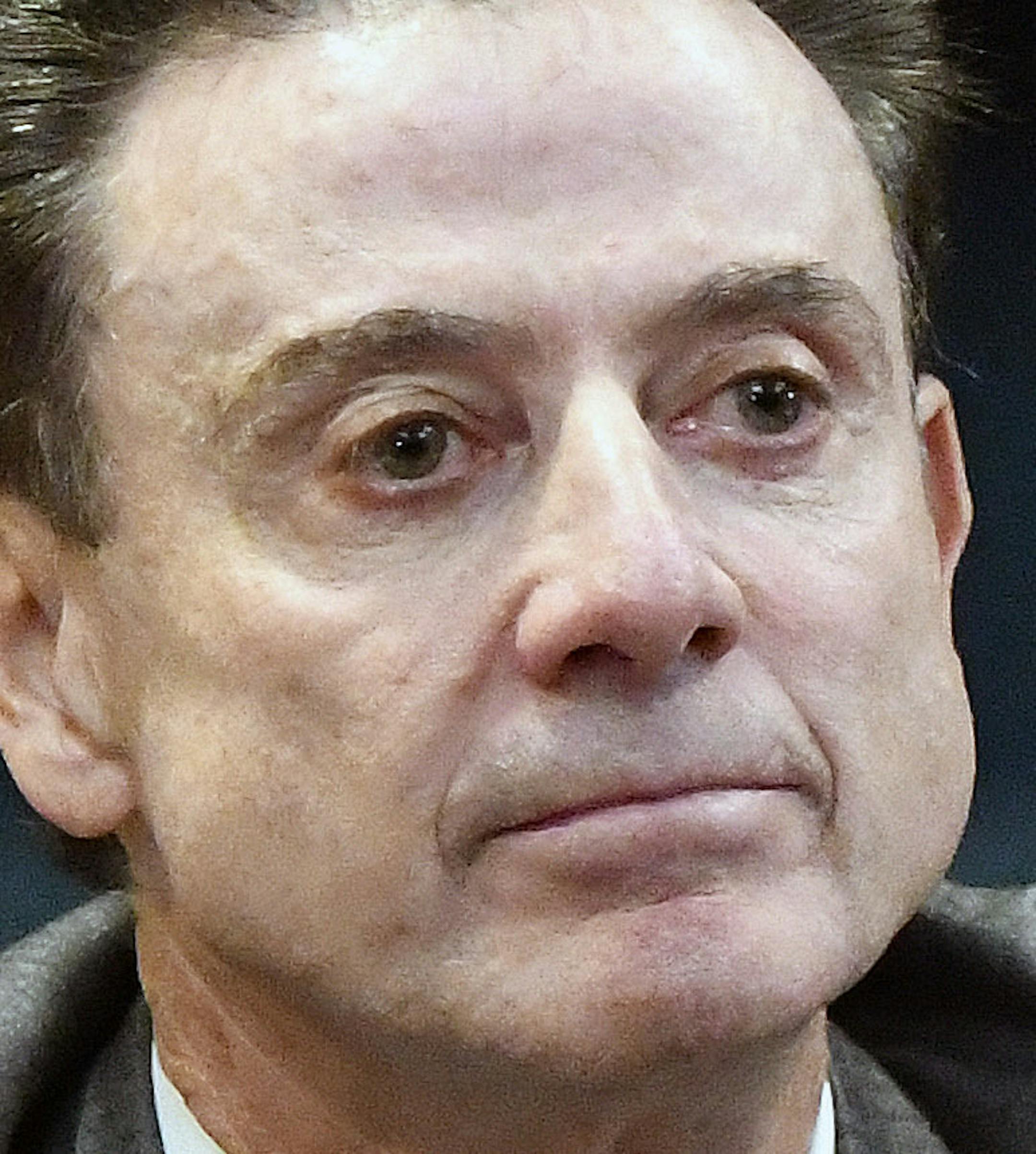 FILE - In this Oct. 20, 2016, file photo, University of Louisville head basketball coach Rick Pitino, left, and Athletic Director Tom Jurich listen during a press conference, in Louisville, Ky. Louisville must vacate its 2013 men&#xed;s basketball title following an NCAA appeals panel&#xed;s decision to uphold sanctions against the men&#xed;s program for violations committed in a sex scandal. The Cardinals will have to vacate 123 victories including the championship, and return millions in posts