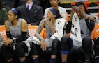 Maya Moore(23), Seimone Augustus(33) and Sylvia Fowles(34) show their disappointment at the impending loss in the last minutes.] The Minnesota Lynx ta