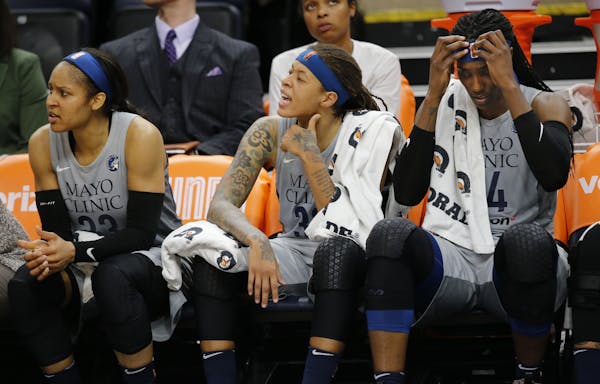 Maya Moore(23), Seimone Augustus(33) and Sylvia Fowles(34) show their disappointment at the impending loss in the last minutes.] The Minnesota Lynx ta