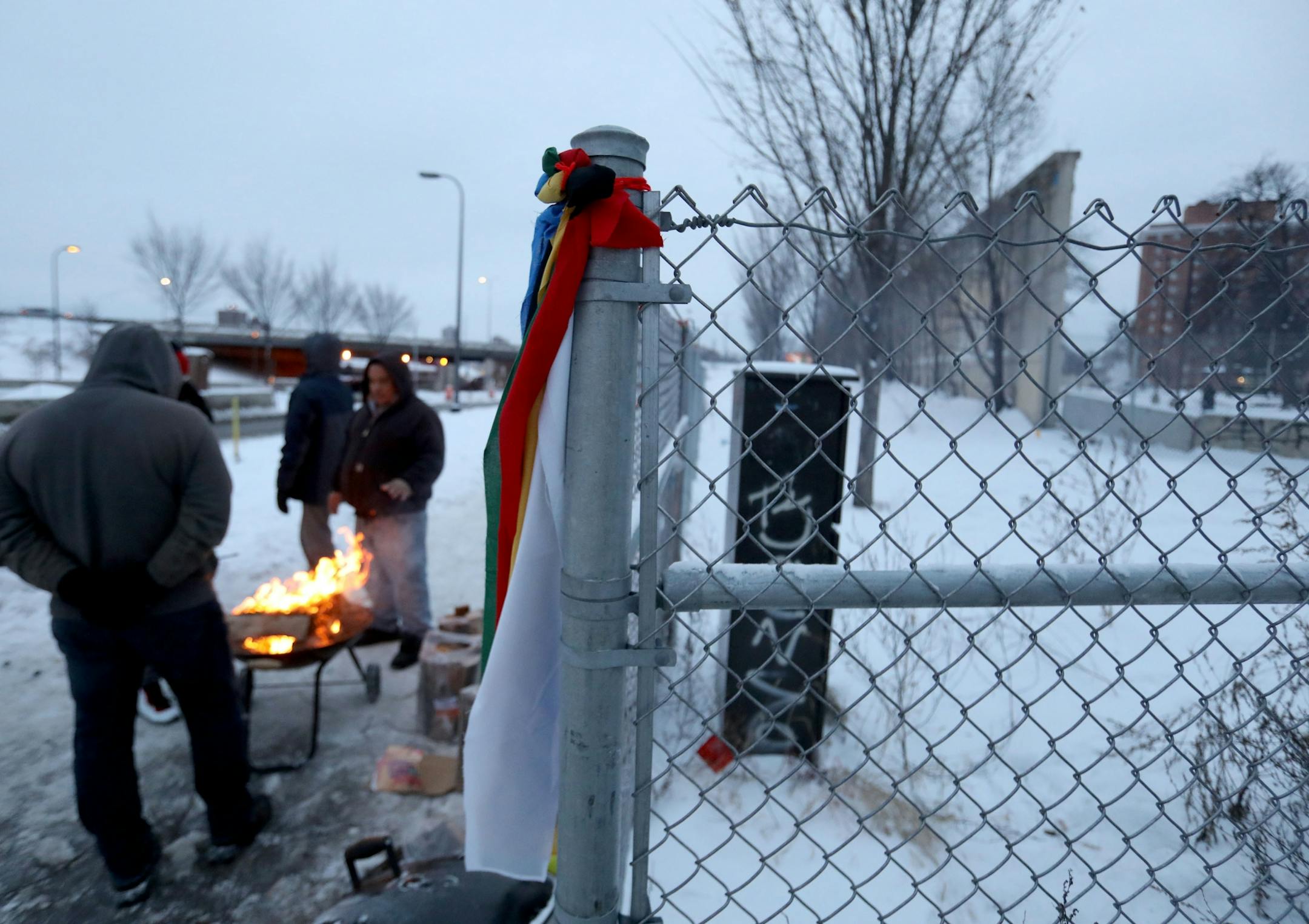 Prayer ties are seen Saturday on a fence near where a teepee was erected during the early morning hours on a stretch of land along Hiawatha and Franklin avenues. Last fall it was the temporary home of several hundred people living in tents.