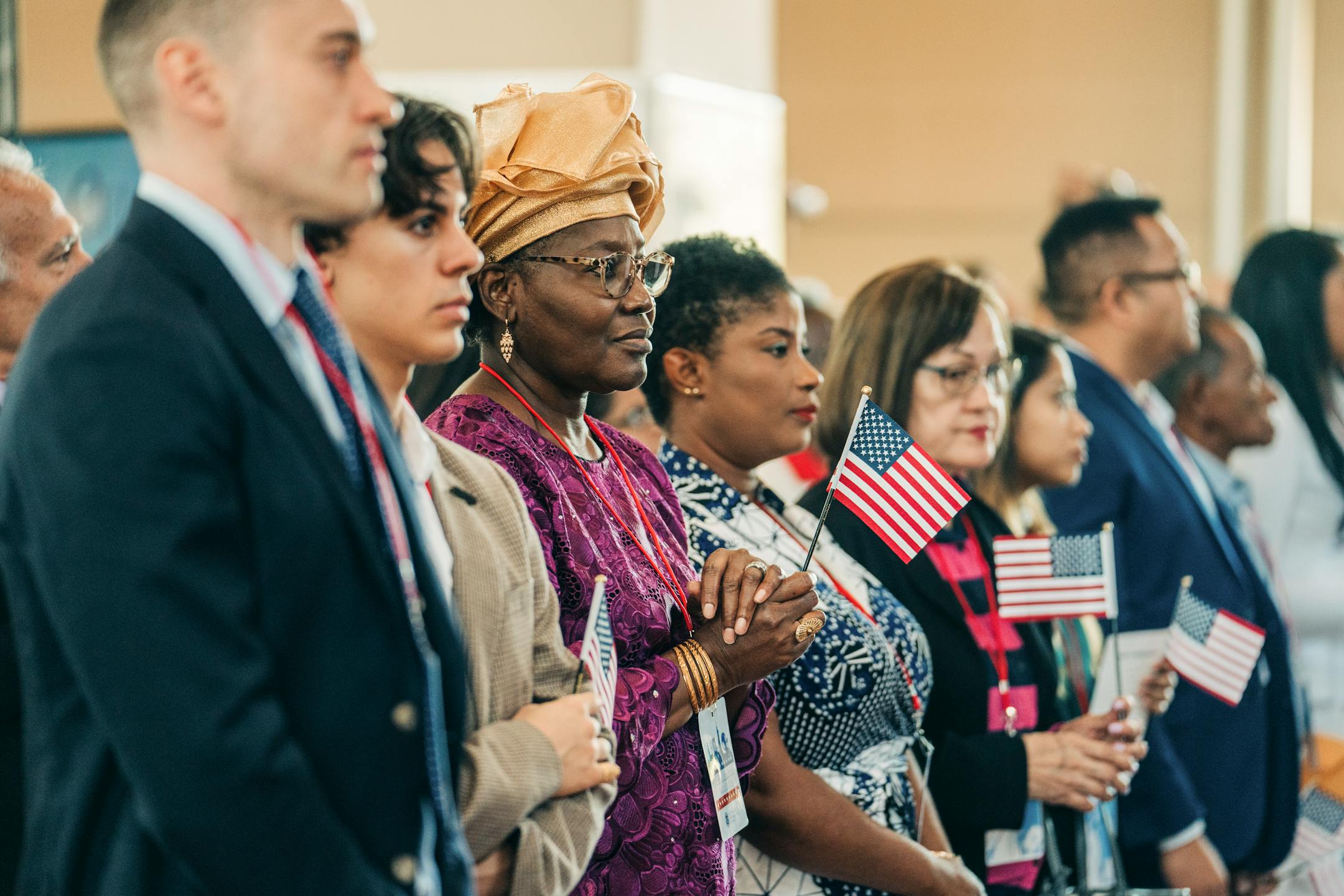 Newly minted U.S. citizens attend a naturalization ceremony at Ellis Island in New York on Saturday, Sept. 17, 2022. An emotional Attorney General Merrick Garland addressed new citizens on Saturday at Ellis Island, the site of his family's American origin story, and warned that the country had become dangerously divided by political factionalism, which has imperiled the democracy and the rule of law.(Jeenah Moon/The New York Times)