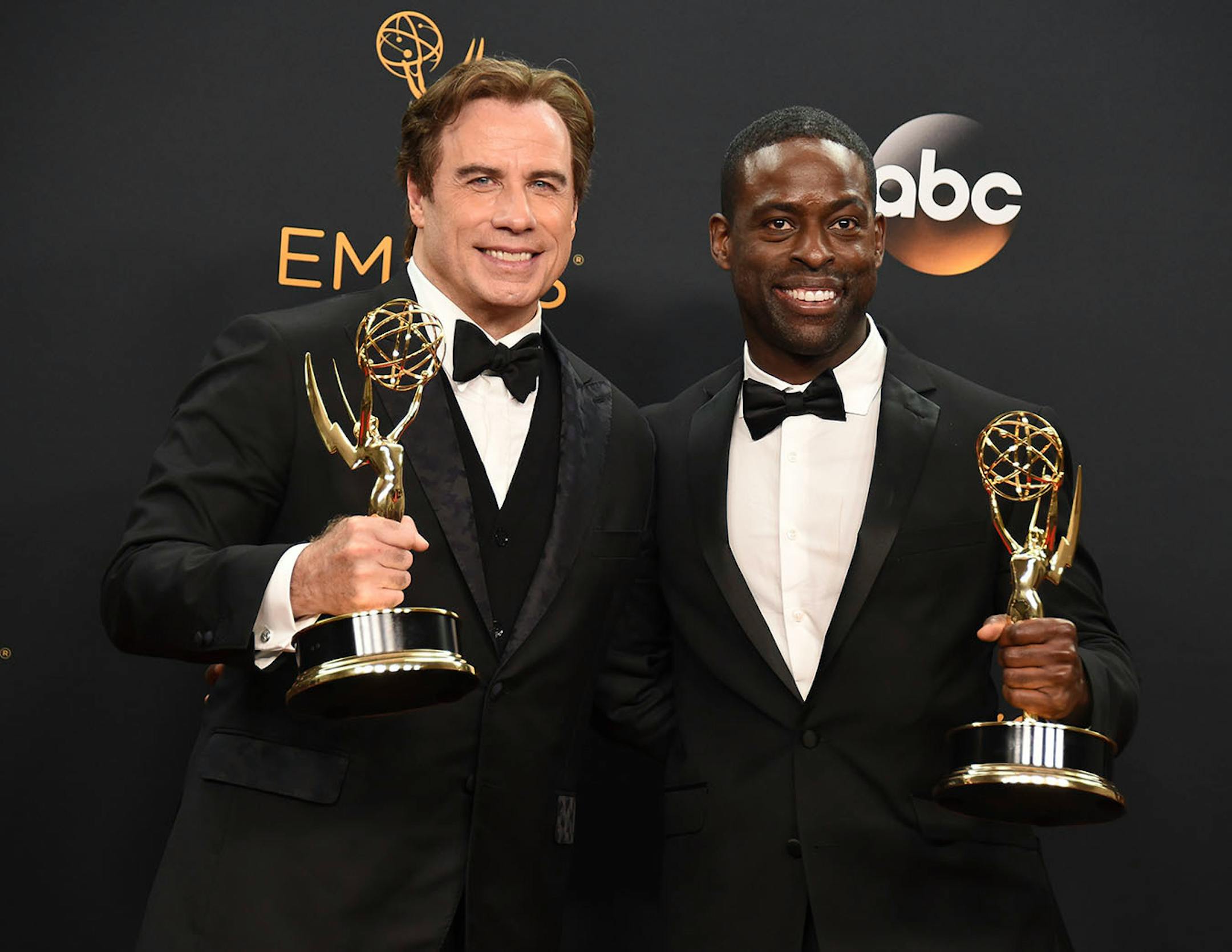 John Travolta, left, winner of the award for outstanding limited series, and Sterling K. Brown winner of the award for outstanding supporting actor in a limited series or a movie for 'The People v. O.J. Simpson: American Crime Story' pose in the press room at the 68th Primetime Emmy Awards on Sunday, Sept. 18, 2016, at the Microsoft Theater in Los Angeles.
