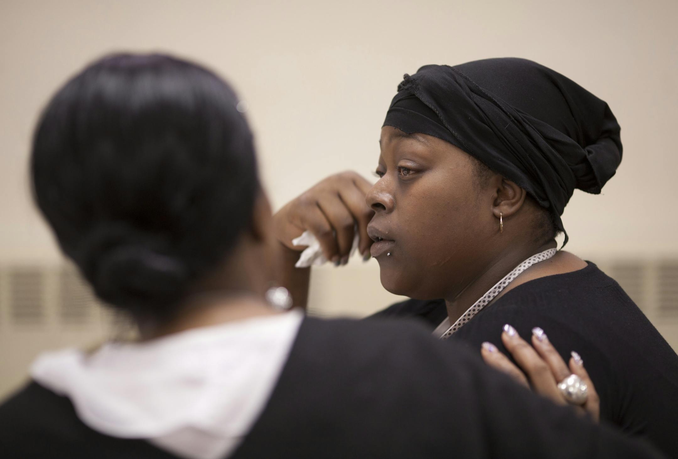 Marsha Mayes, right, mother of three-year-old Terrell Mayes, who was killed by a stray bullet in December, talked with Constance Styles on Sunday.