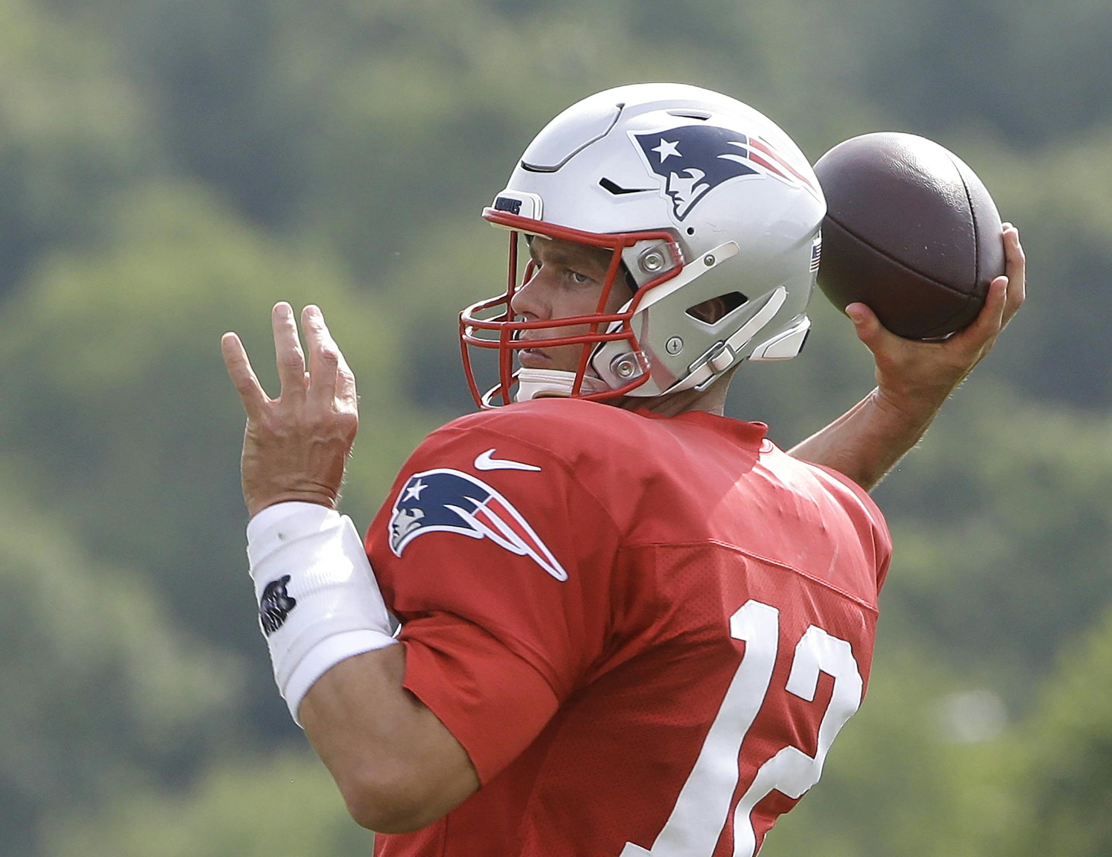 New England Patriots quarterback Tom Brady winds up to pass during an NFL football training camp practice, Thursday, Aug. 1, 2019, in Foxborough, Mass. (AP Photo/Steven Senne)