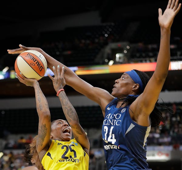 Indiana Fever's Cappie Pondexter (25) is fouled by Minnesota Lynx's Sylvia Fowles during the second half Wednesday.