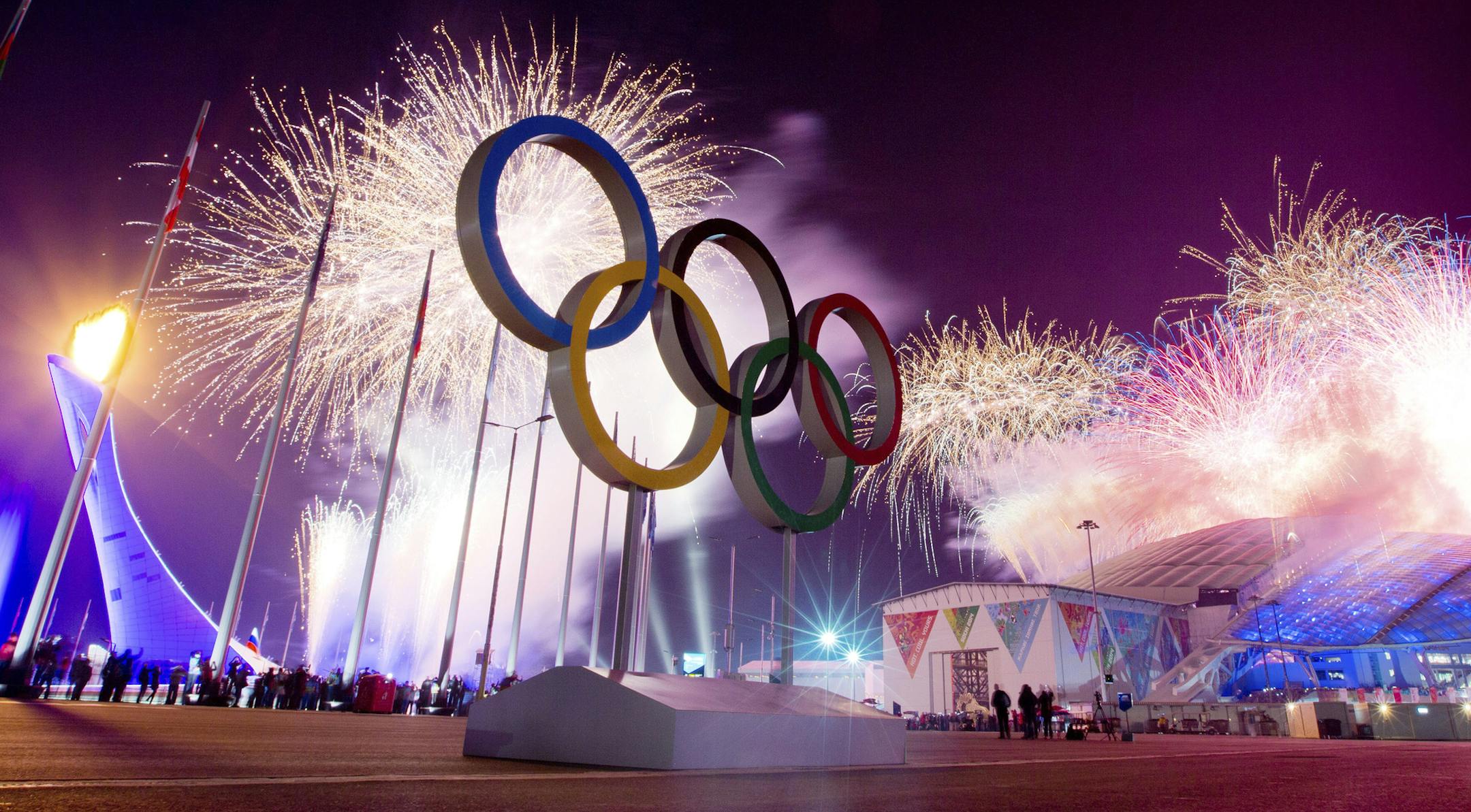 Fireworks beside five Olympic rings commemorate the start of the 2014 Olympic Winter Games outside Fisht Olympic Stadium in Sochi, Russia, Feb. 7, 2014. After seven years of building to the opening of the Winter Olympics, the message of Friday's over-the-top ceremony was simply this: In a big way, Russia is back. (Josh Haner/The New York Times)