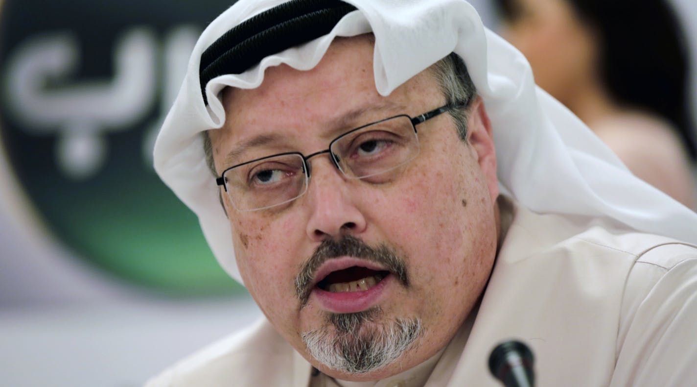 FILE - In this Feb. 1, 2015, file photo, Saudi journalist Jamal Khashoggi speaks during a press conference in Manama, Bahrain. The disappearance of Khashoggi, during a visit to his country&#xed;s consulate in Istanbul on Oct. 2, 2018, raises a dark question for anyone who dares criticize governments or speak out against those in power: Will the world have their back? (AP Photo/Hasan Jamali, File)