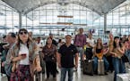 Travelers at Hong Kong International Airport, where a general strike grounded almost 200 flights, most of them with Cathay Pacific, in Hong Kong, Aug.