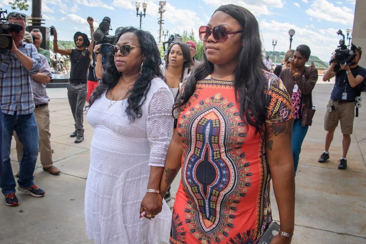 Valerie Castile, Philando's mother, left, and Allysza Castile, Philando's sister, right, leave the courthouse at the end of the fourth day of jury deliberation on Thursday, June 15, 2017, in St. Paul.