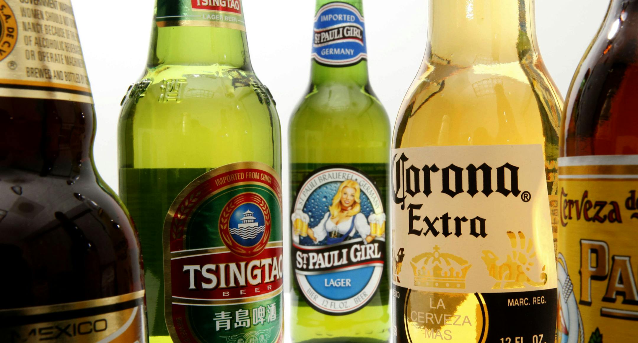 FILE - In this Oct. 5, 2010 photo shows bottles of Constellation Brands, Inc., beer products, including, from left, Negra Modelo, Tsingtao, St. Pauli Girl, Corona Extra and Pacifico in Philadelphia. Constellation Brands, maker of Svedka vodka and Black Velvet whiskey, gave its CEO a $10,000 "product allowance," so he could enhance his "knowledge and appreciation of our products." CEO Robert Sands, who made $7.7 million in fiscal 2012, used up $5,532 last year. (AP Photo/Matt Rourke) ORG XMIT: MI