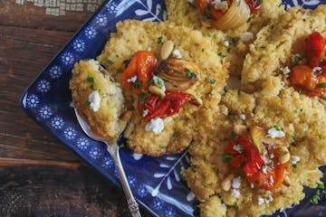 Millet Polenta Cakes with Roast Tomatoes and Garlic.