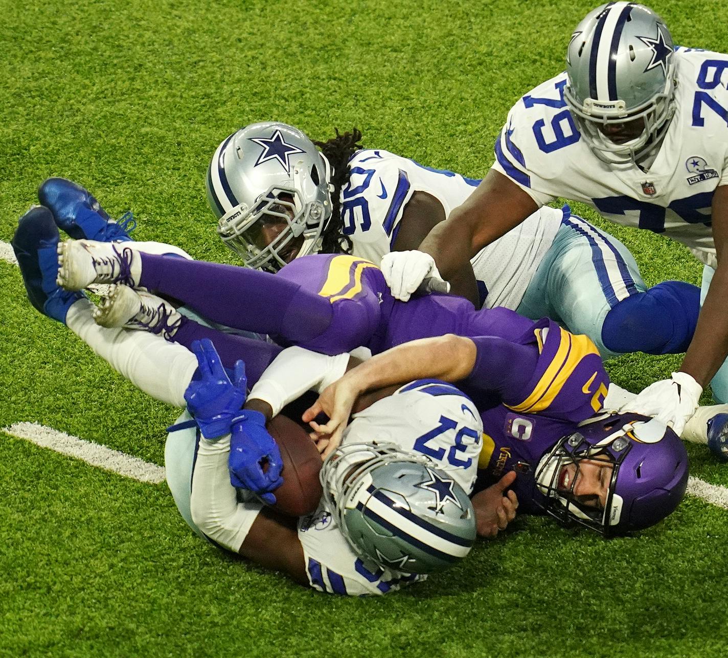 Kirk Cousins had the ball stripped by Dallas' Donovan Wilson, but the officials neglected to call Wilson's helmet-to-helmet hit on the Vikings quarterback.