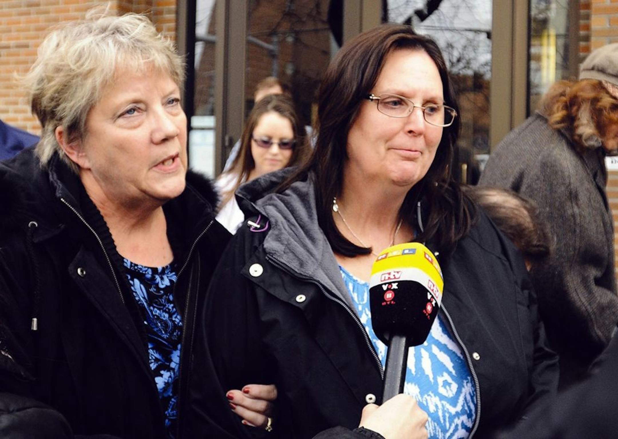 Cody Johnson's mother, Sherry Johnson, right, leaves the federal courthouse with her sister-in-law Celeste Watson, in Missoula, Mont., Thursday, March 27, 2014.