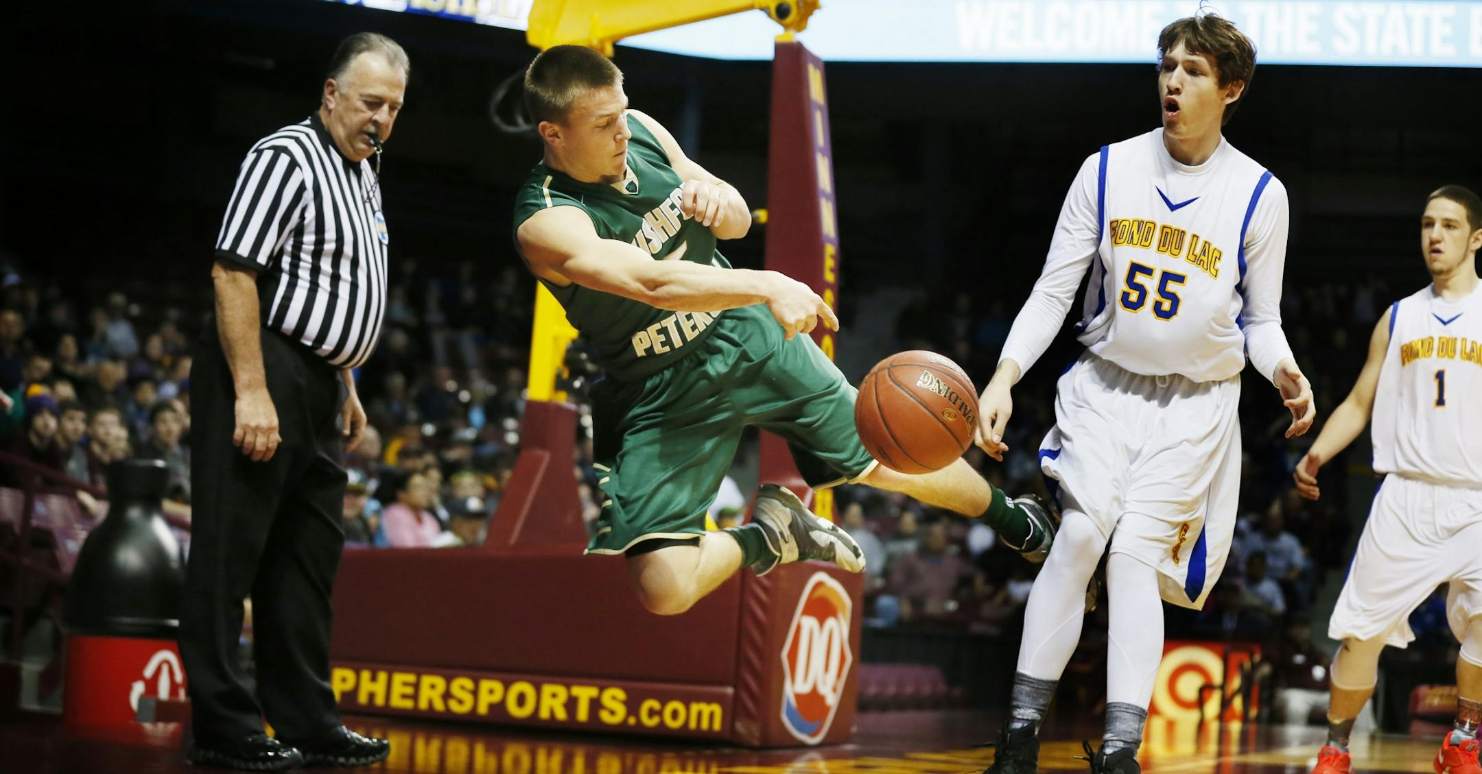 Alex Vix of Rushford-Peterson saved the ball from going out of bounds as Allen Trulson of Fond du Lac Ojibwe looked on in the first half.
