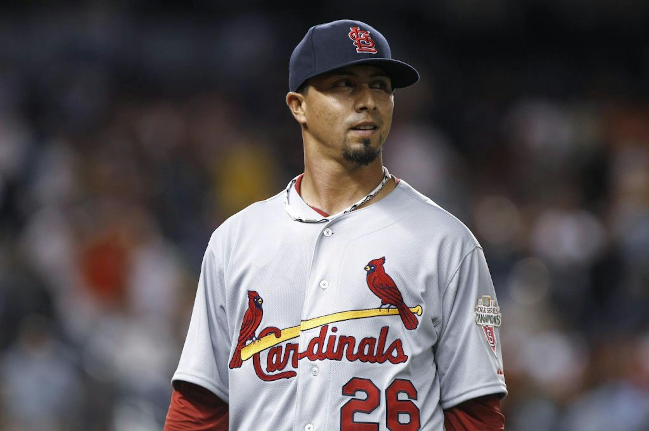 St. Louis Cardinals starting pitcher Kyle Lohse walks to the dugout after the seventh inning against the Miami Marlins in the Opening Day baseball game Wednesday, April 4, 2012, in Miami. The Cardinals defeated the Marlins 4-1.