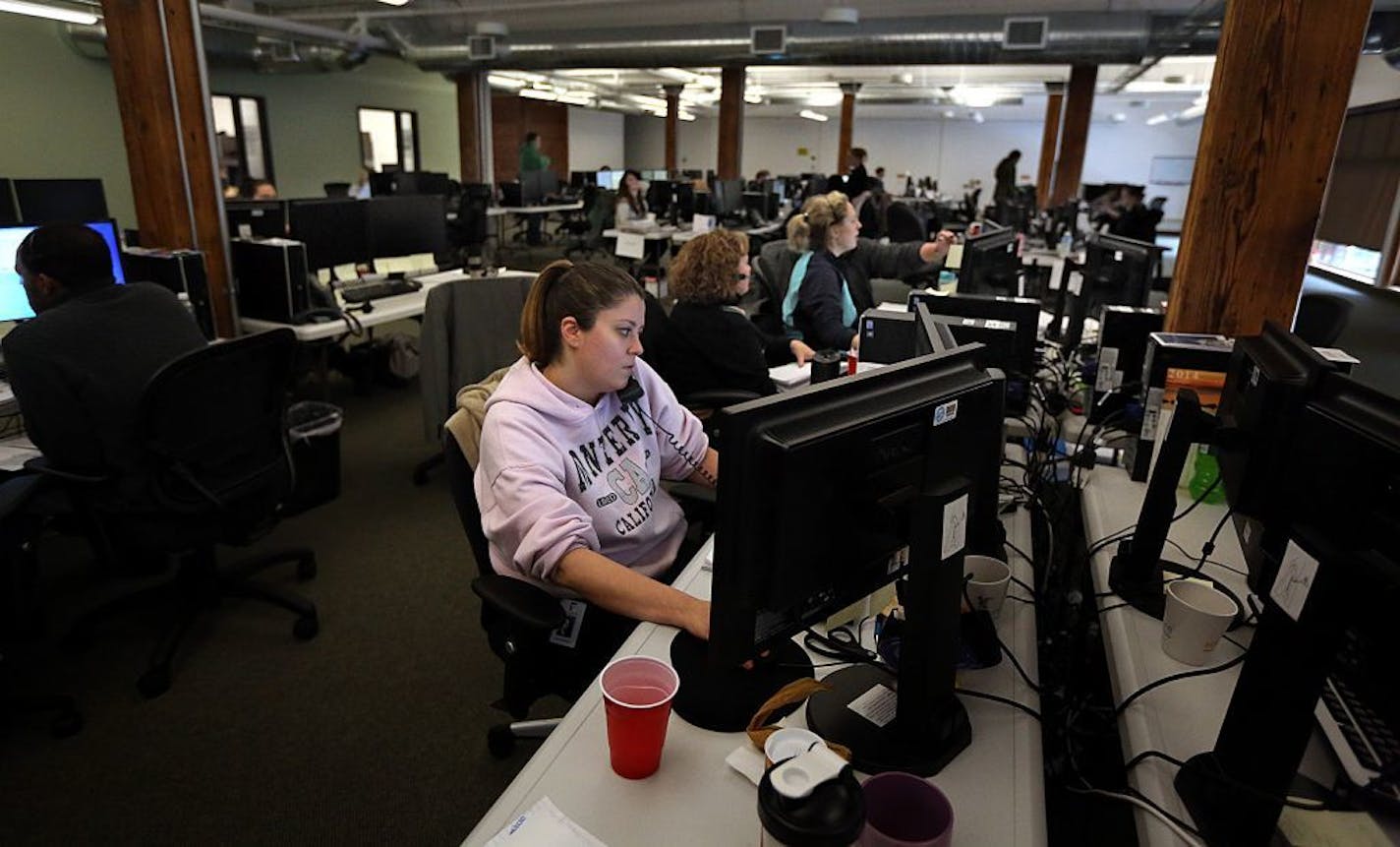 MNsure call center guide Christy Williamson and others worked the phones on the final day for people to sign up for health insurance under terms of the Affordable Care Act.