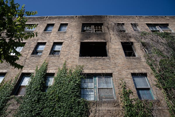 Fire broke out early Monday at a vacant Loring Park apartment building that has been used by squatters for years.