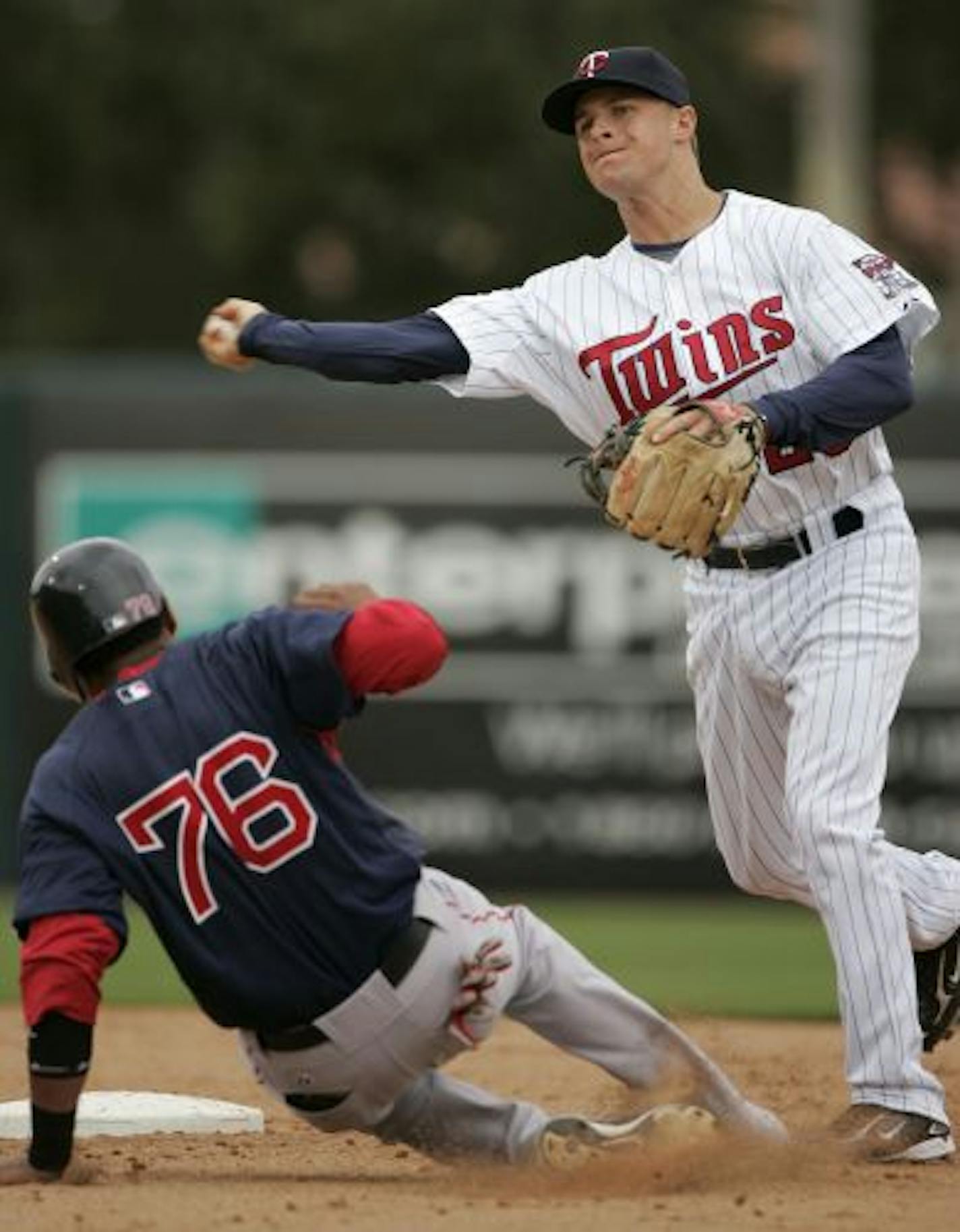 Matt Tolbert threw to first after forcing out Boston's Diaz Argenis during the Twins' 2-1 loss the Red Sox on Sunday in Fort Myers. Tolbert can play second, short or third.