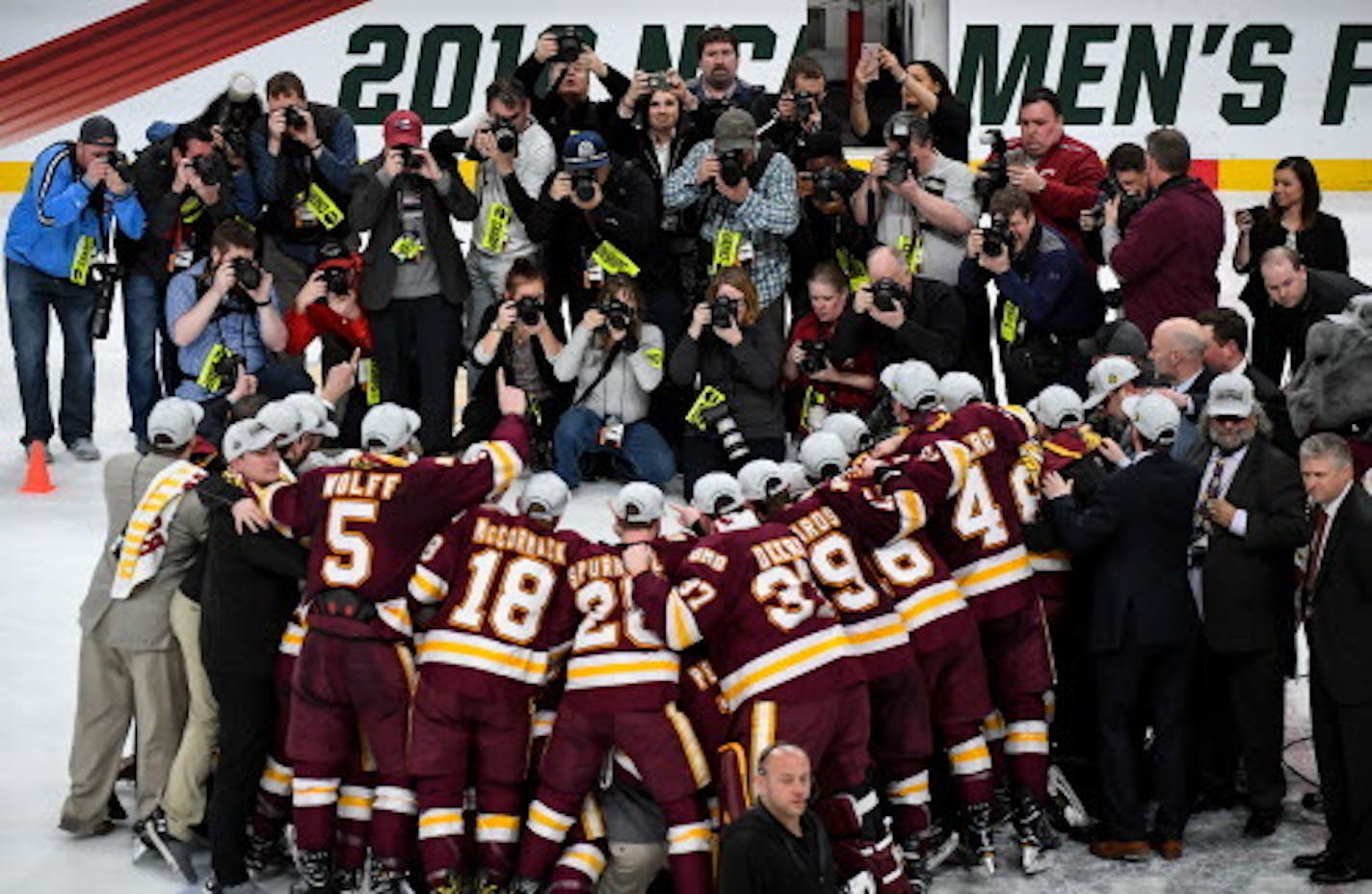 A gaggle of photographers took a team photo of the Minnesota-Duluth Bulldogs following their NCAA championship victory over the Notre Dame Fighting Irish.     ] AARON LAVINSKY ' aaron.lavinsky@startribune.com