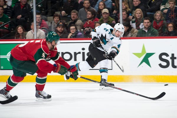 San Jose Sharks defenseman Marc-Edouard Vlasic (44) gets off a shot while being defended by Minnesota Wild defenseman Christian Folin (5) in the final